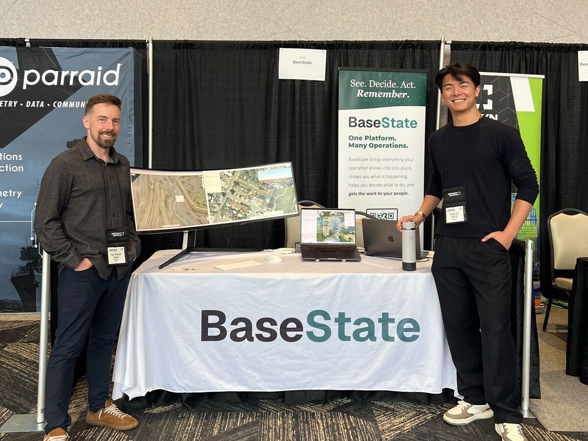 Paul and Hanyi demonstrating real-time stormwater simulation and autonomous inspections at the UAS Summit.